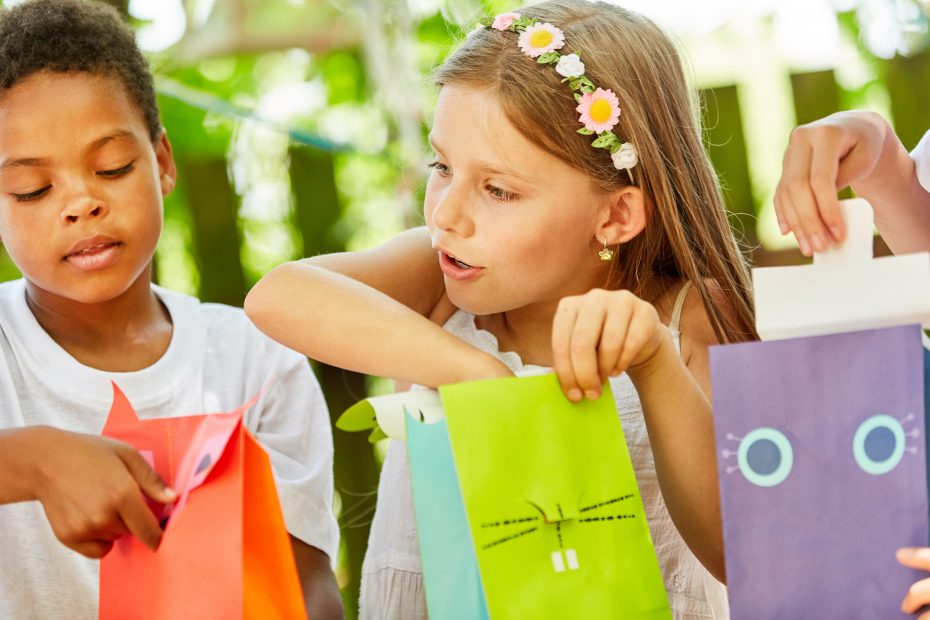 plastic-free party bags with children excitedly opening them