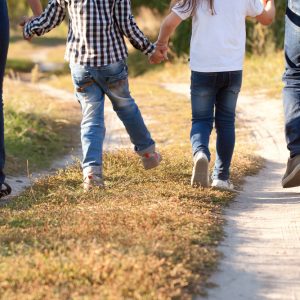 Family,Feet,And,Legs,In,Jeans.,Father,,Mother,,Son,And